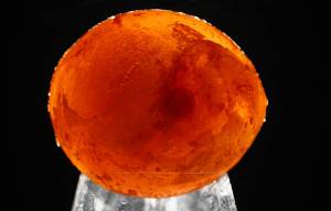 Ice Marble made with food colors and water in a balloon in the freezer.